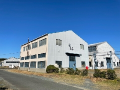 株式会社　日進機械製作所